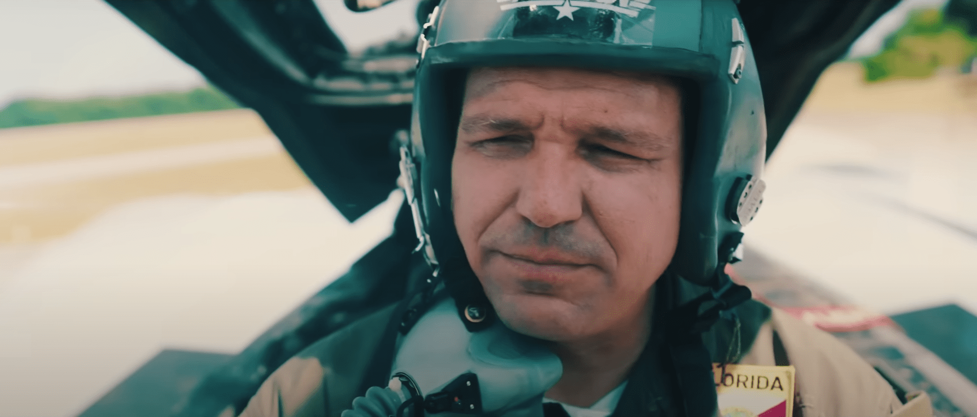 Gov. Ron DeSantis, shown posing as a fighter pilot in a campaign ad, wants his real-life jet travel shielded from public view.